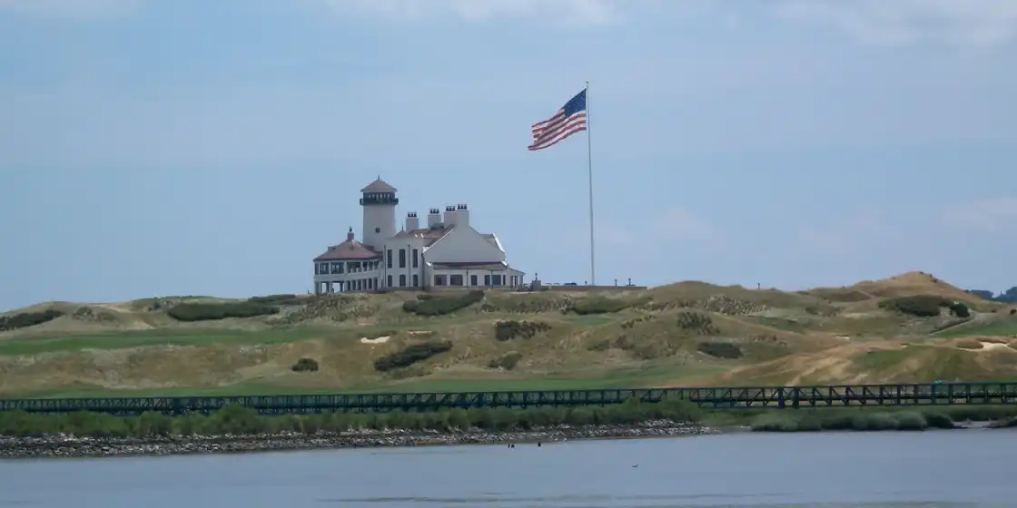 Bayonne Golf Club's lighthouse-style clubhouse on the dunes above the water
