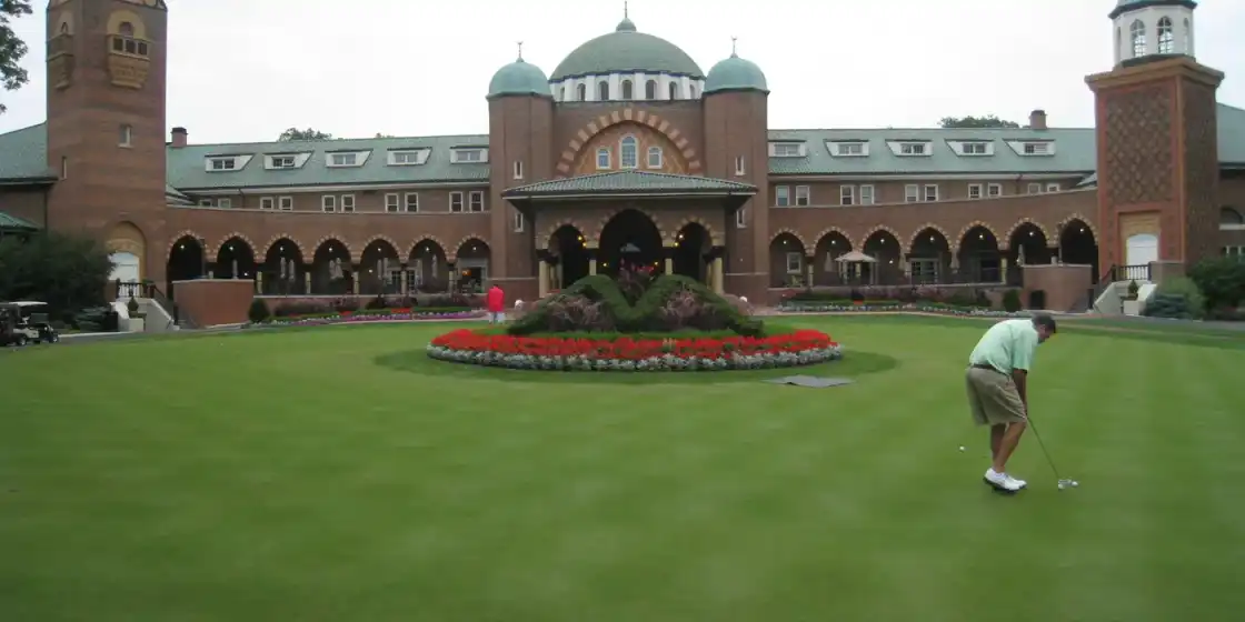 Practice putting green in front of the domed Byzantine-style clubhouse at Medinah Country Club