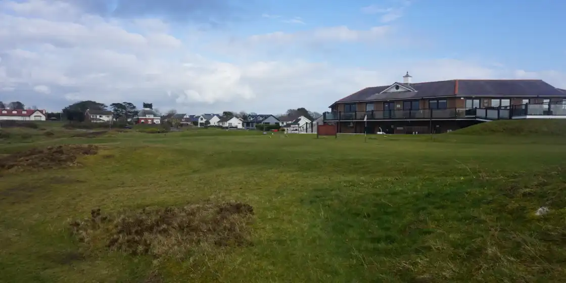 Rough links ground below the clubhouse at Pennard Golf Club on the Gower