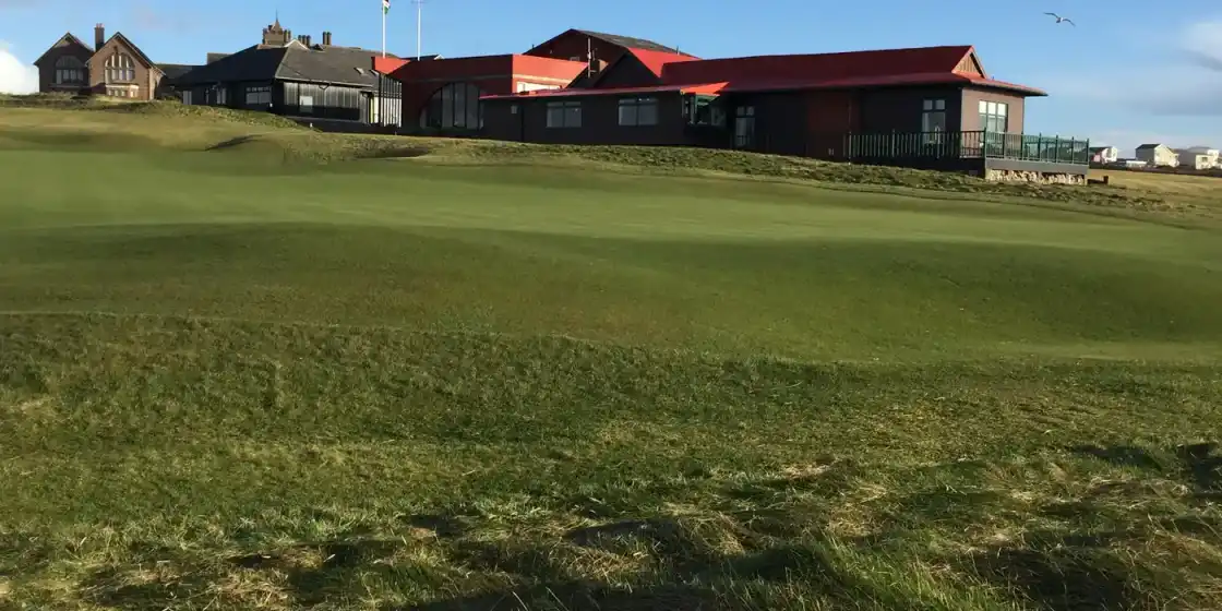 A fairway rising to the clubhouse at Royal Porthcawl Golf Club