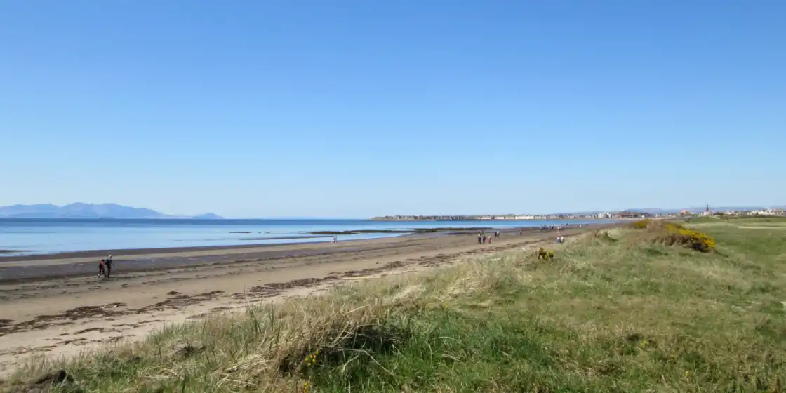 View from top of sand dunes forming the perimeter of the Royal Troon Golf Club course, looking ou...