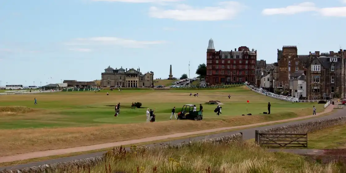 View looking towards the 17th and 18th holes of the Old Course, St Andrews, with the club house o...