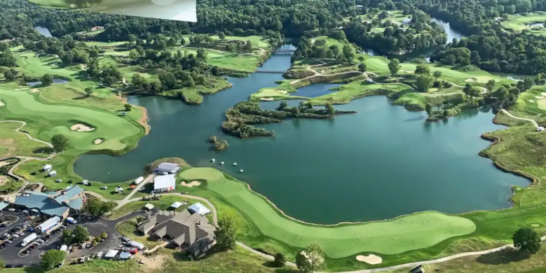 Aerial view of Victoria National Golf Club, showing the 18th fairway, the clubhouse and its lakes
